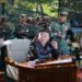 Pemimpin Korea Utara Kim Jong Un mengunjungi pangkalan pelatihan pasukan operasi khusus Angkatan Bersenjata Korea di lokasi yang dirahasiakan, di Korea Utara, dalam gambar yang dirilis oleh Kantor Berita Pusat Korea (KCNA) pada 4 Oktober 2024. KCNA via REUTERS.